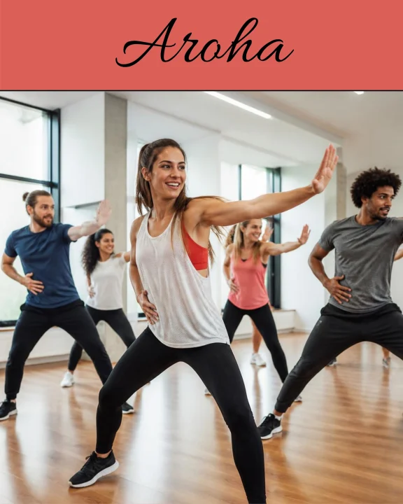 Participants réalisant une chorégraphie dynamique lors d’un cours collectif d’Aroha en salle.